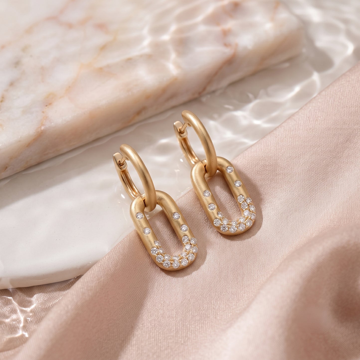 Lucent's Linked Diamond Huggies in Yellow Gold